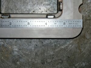 Laser TIG welding on a part. Ruler shown for scale