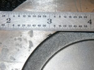 Laser TIG welding performed by Five Star Tool Welding on a metal ring. Ruler shown for scale