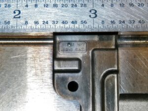 Micro TIG welding on a part. Ruler shown for scale